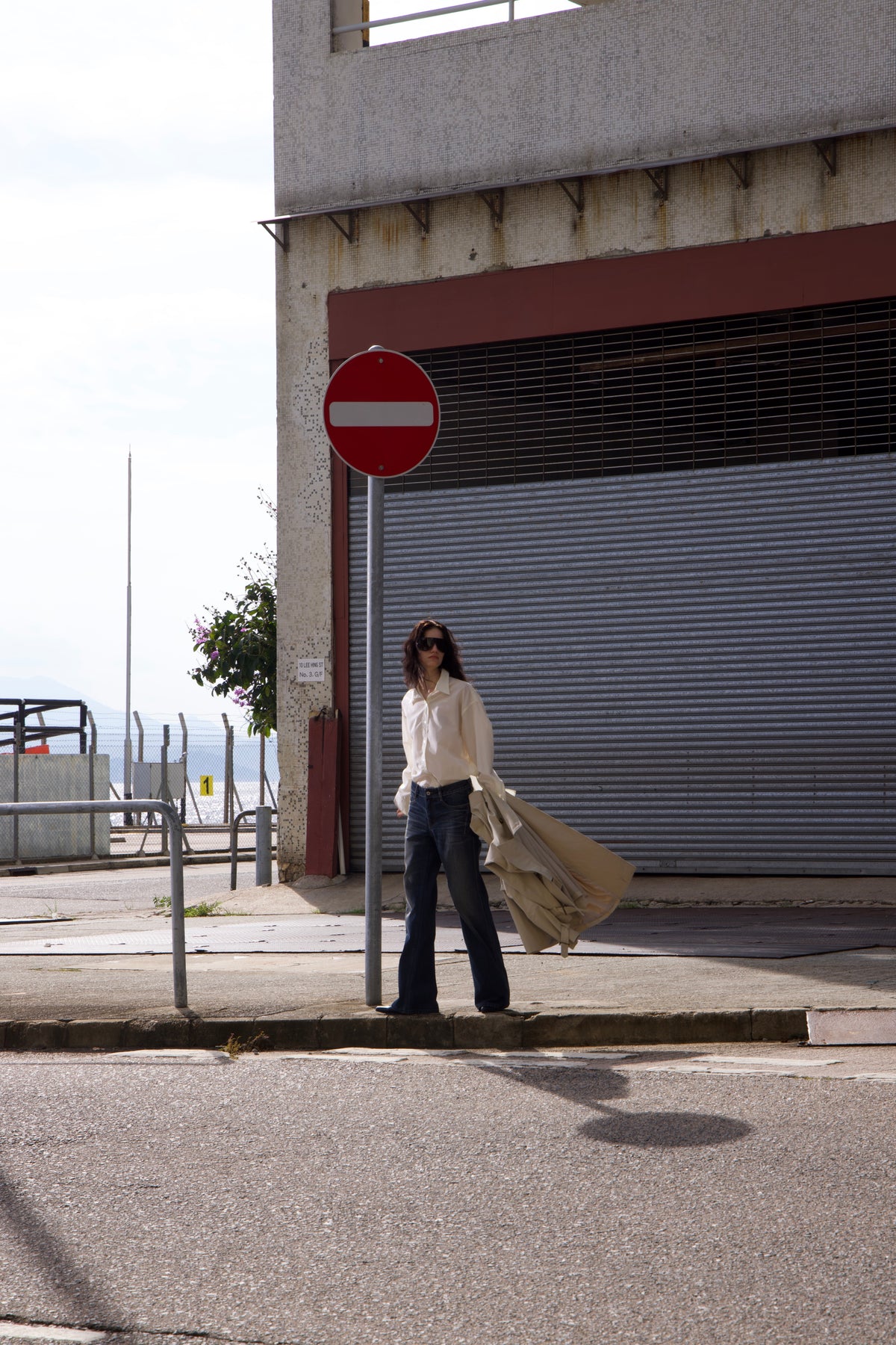 TAYACU editorial — white shirt and denim by the waterfront